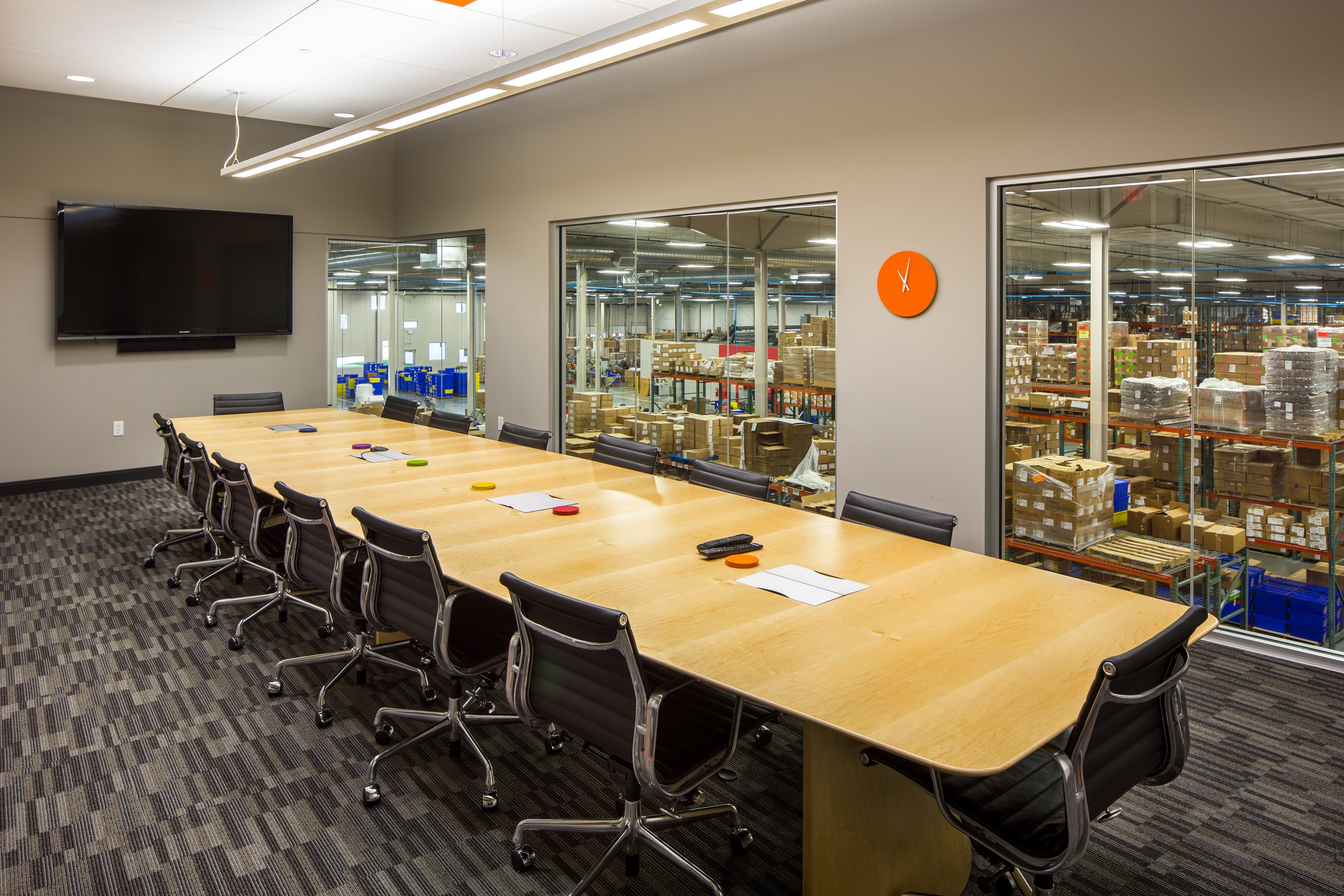 Haven-delivered headquarters boardroom overlooking distribution floor